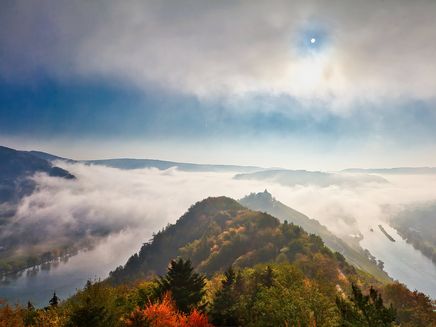 View The picture shows the view from the Prinzenopfturm in foggy autumn weather. The Mosel is separated by a mountain.