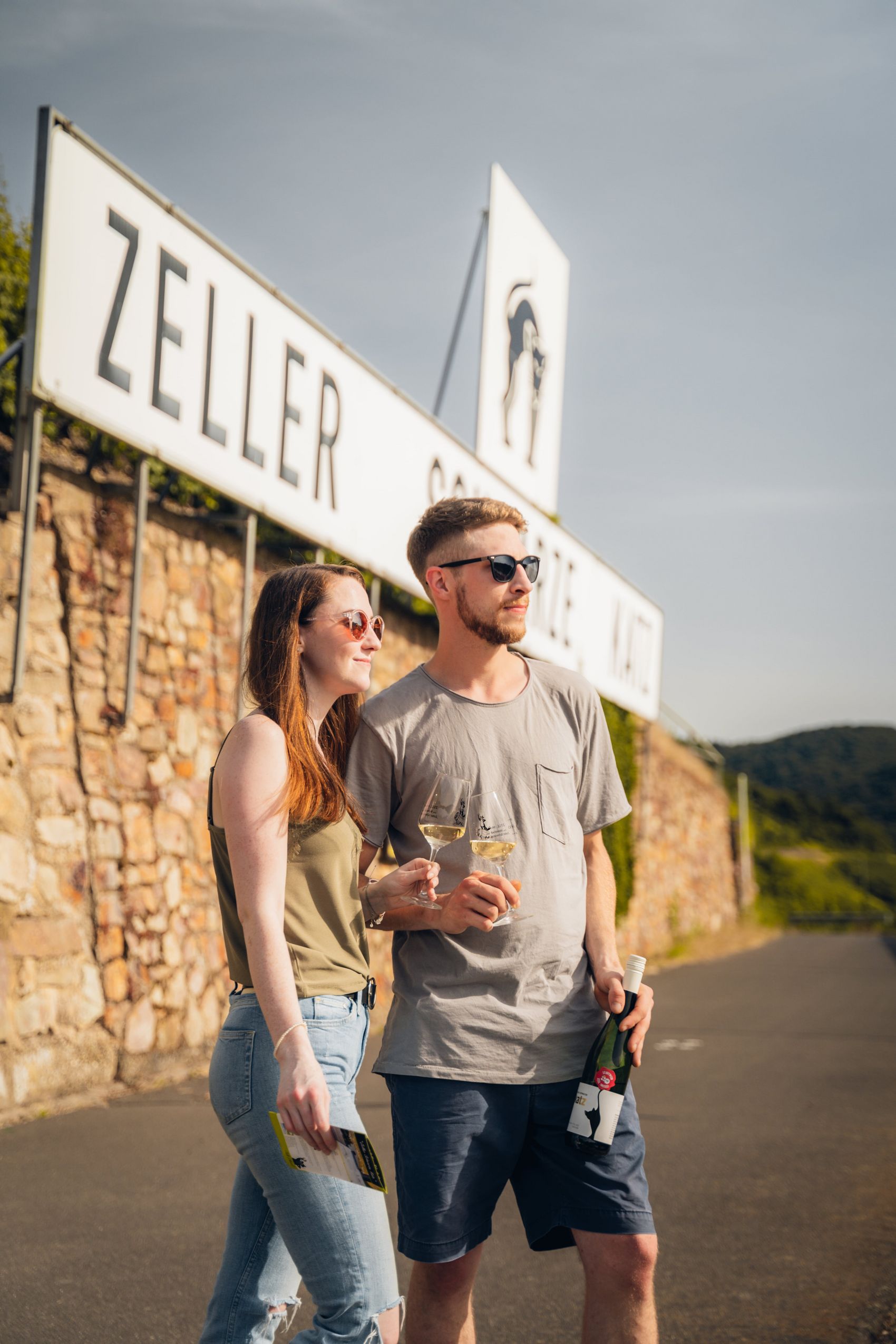 Vineyard sign There are two young people standing in front of the