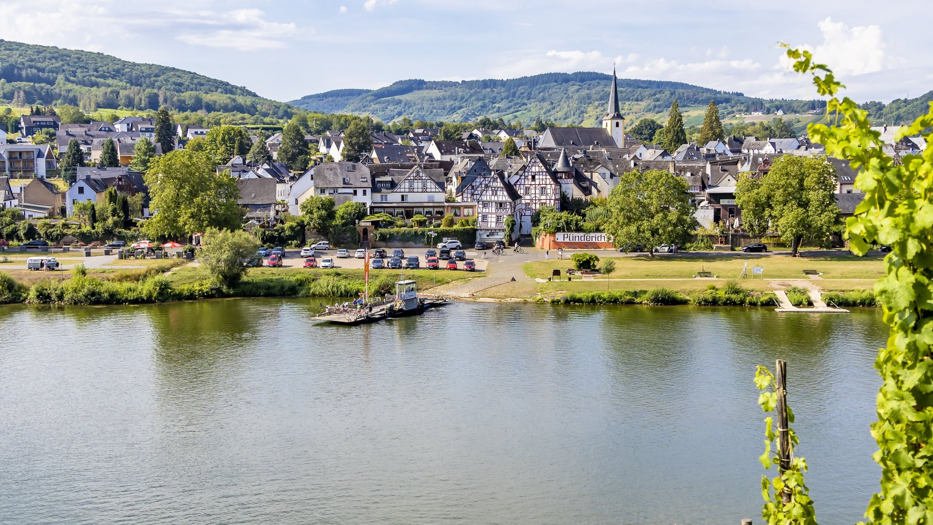 Pünderich The picture shows a frontal view of the Moselle village of Pünderich with its half-timbered houses. The picture was taken in the vineyards on the opposite side of the Mosel.