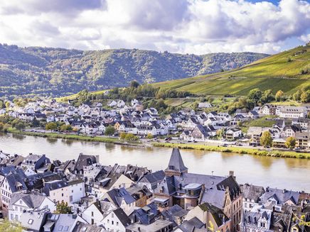 Zell on the Mosel The picture, which was taken from the vineyards behind Zell, shows a section of the town centre and the district of Kaimt opposite. The Mosel separates the two districts.